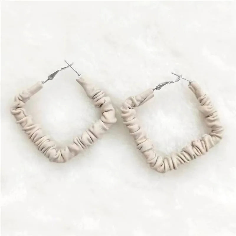 Metal plated hotsell faux leather woven earring